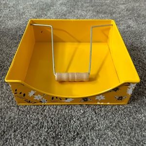 Metal bumblebee napkin holder.